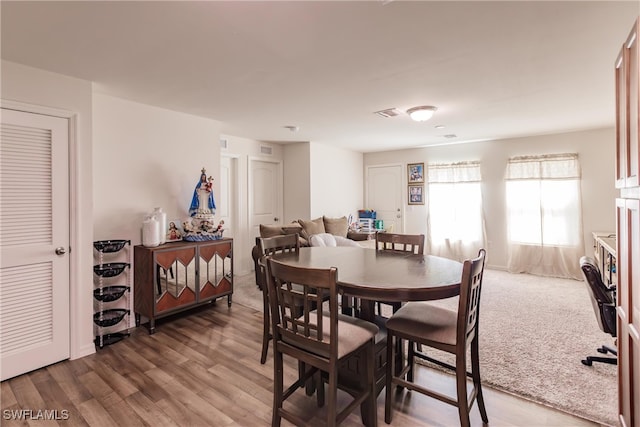 dining space featuring hardwood / wood-style floors