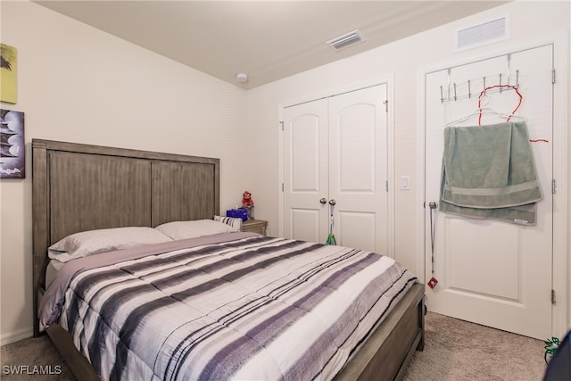 carpeted bedroom featuring a closet