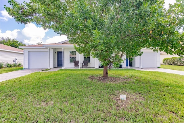 view of front of house with a garage and a front yard