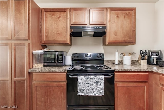 kitchen featuring black electric range oven and extractor fan