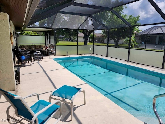 view of swimming pool featuring an outdoor living space, a lanai, and a patio