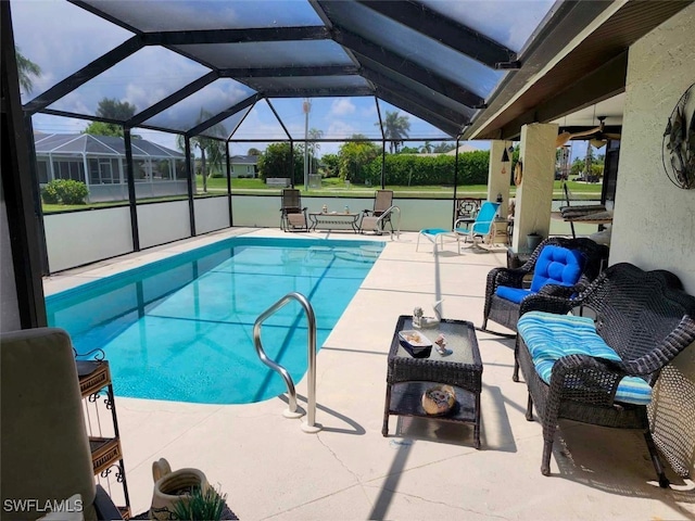 view of swimming pool featuring a patio area, a lanai, and an outdoor living space