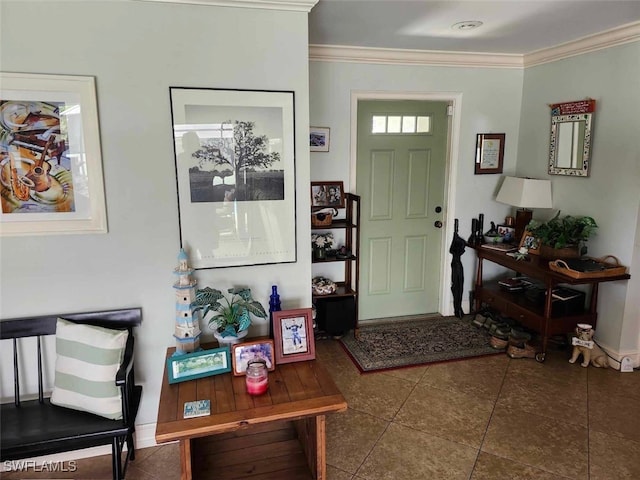 entryway featuring dark tile patterned floors and ornamental molding