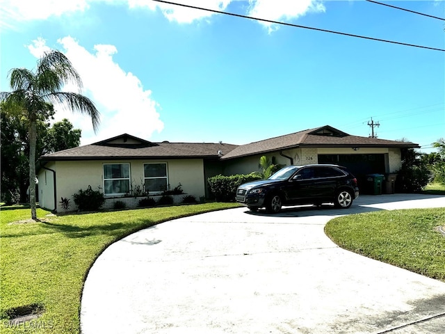 single story home with a front yard and a garage