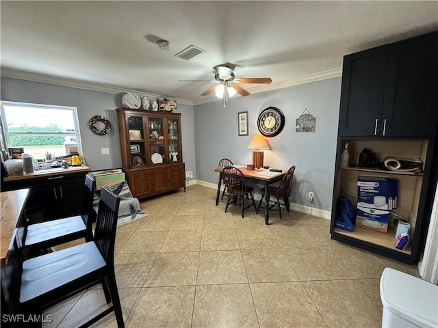 dining space featuring ceiling fan, ornamental molding, and light tile patterned floors