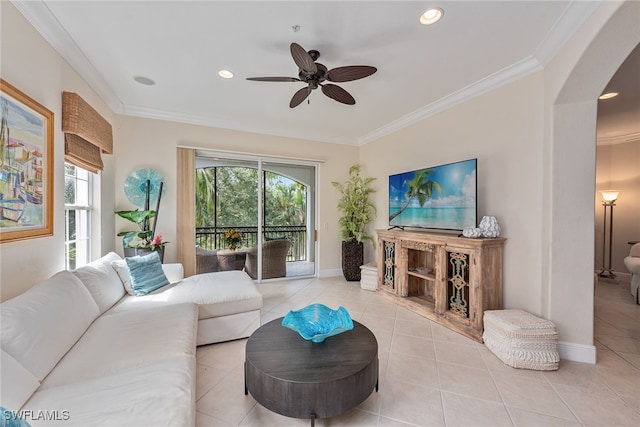 living room with ceiling fan, light tile patterned floors, and crown molding