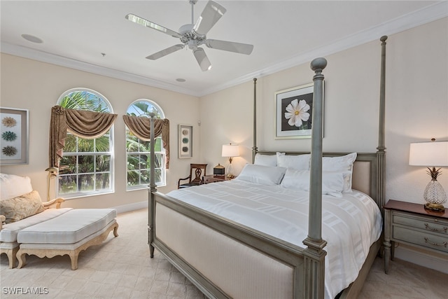 bedroom with ornamental molding and ceiling fan