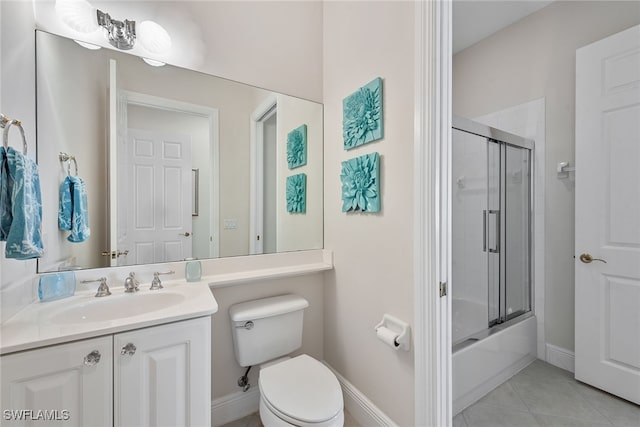 full bathroom featuring enclosed tub / shower combo, tile patterned flooring, vanity, and toilet