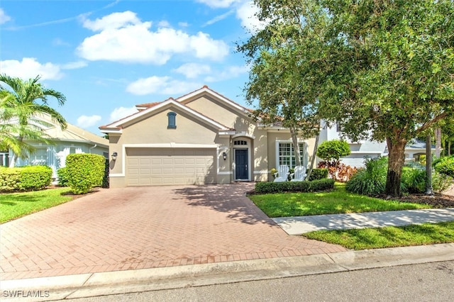 view of front facade featuring a garage and a front lawn