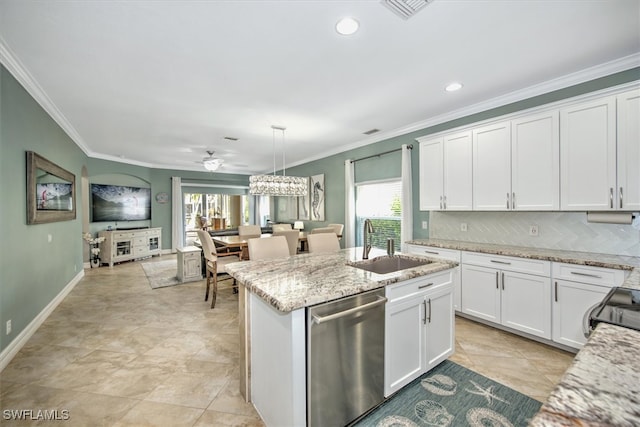 kitchen with dishwasher, white cabinetry, a wealth of natural light, and decorative light fixtures