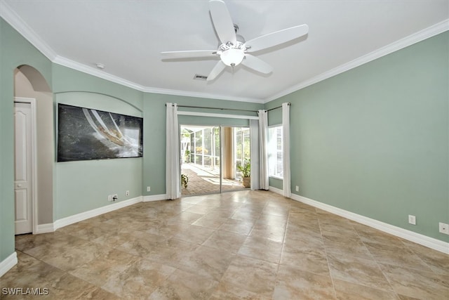 spare room with crown molding and ceiling fan