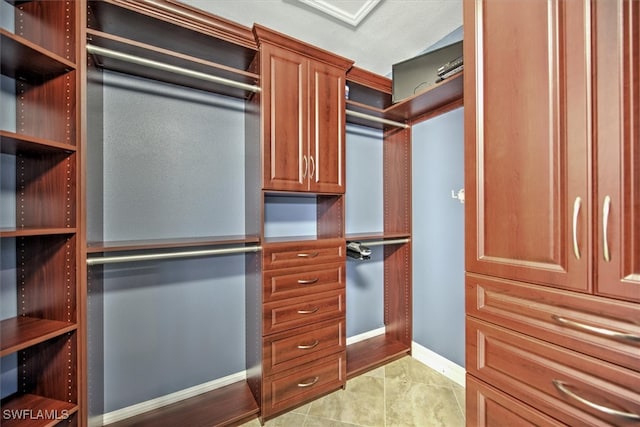 walk in closet featuring light tile patterned floors