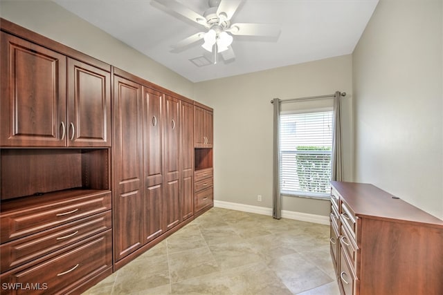 interior space featuring ceiling fan