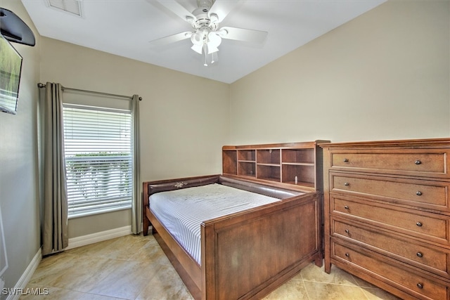 tiled bedroom with ceiling fan