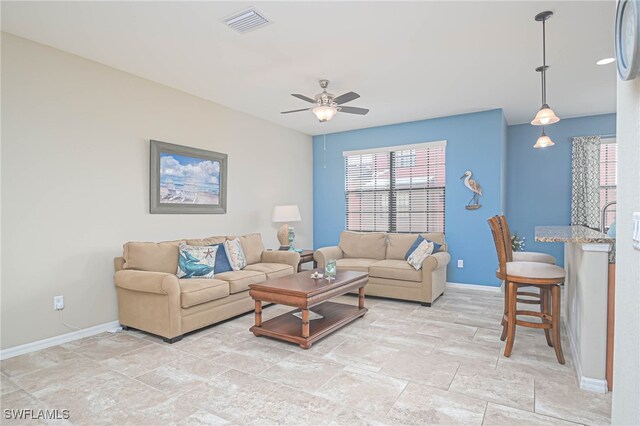 living room featuring ceiling fan