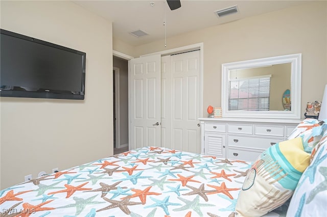 bedroom featuring ceiling fan and a closet