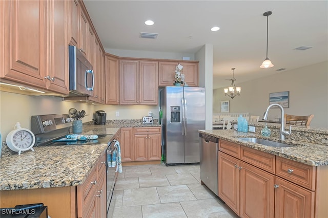 kitchen with pendant lighting, a chandelier, stainless steel appliances, sink, and light stone countertops