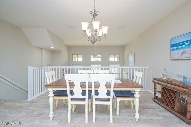 dining space featuring a notable chandelier