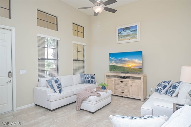 living room featuring ceiling fan and light tile patterned floors