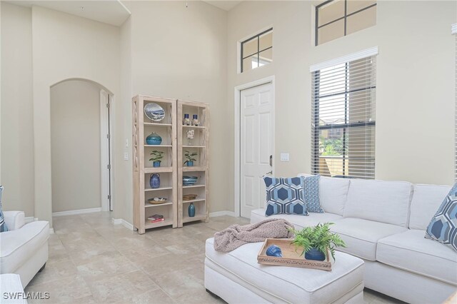 living room with a high ceiling