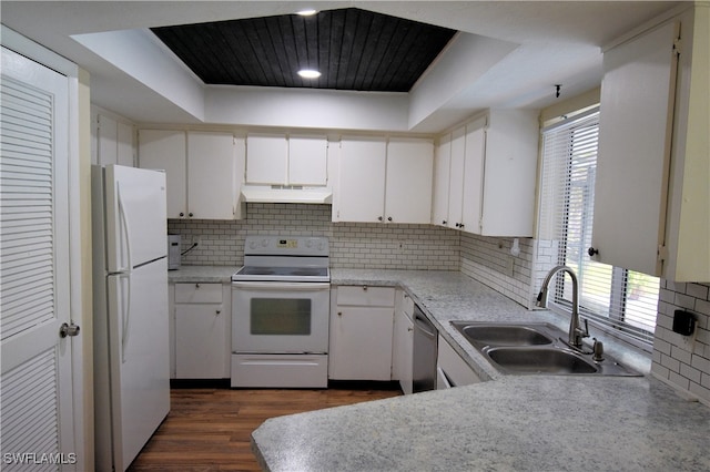 kitchen featuring white cabinetry, white appliances, a healthy amount of sunlight, and sink