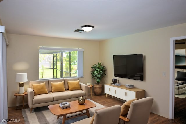 living room featuring dark hardwood / wood-style flooring