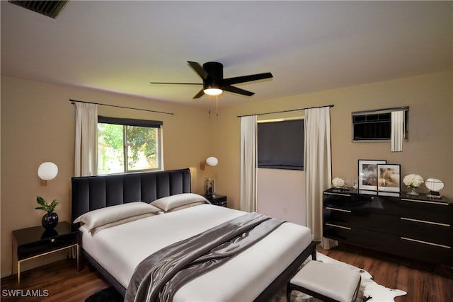 bedroom featuring dark hardwood / wood-style flooring and ceiling fan