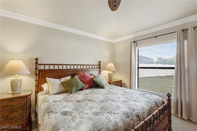 bedroom featuring crown molding and carpet