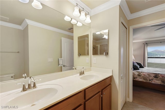 bathroom featuring vanity, crown molding, tile patterned flooring, ceiling fan, and toilet