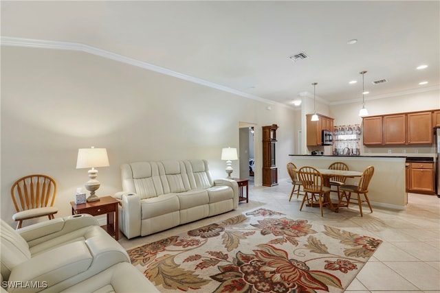 living room featuring light tile patterned floors and crown molding