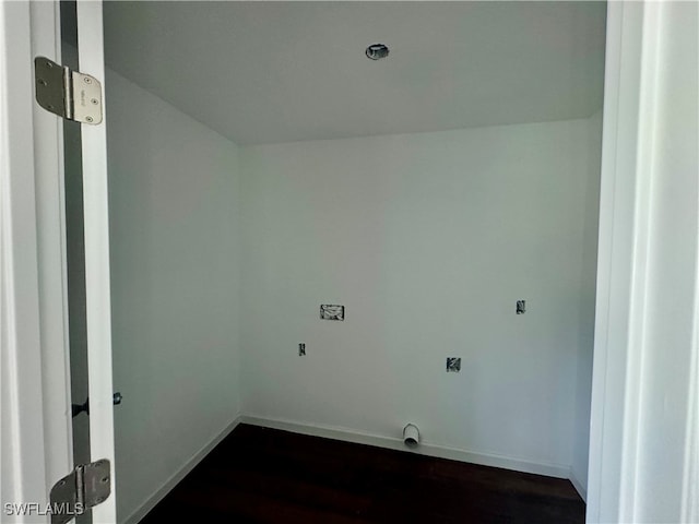 laundry room with dark wood-type flooring and electric dryer hookup