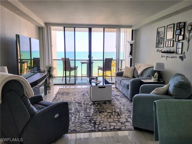 450 S Gulfview Blvd Unit 505, Clearwater, FL 33767 - living room with expansive windows and wood finished floors
