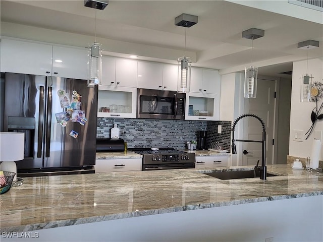 450 S Gulfview Blvd Unit 505, Clearwater, FL 33767 - kitchen featuring stainless steel appliances, decorative backsplash, white cabinets, and light stone countertops