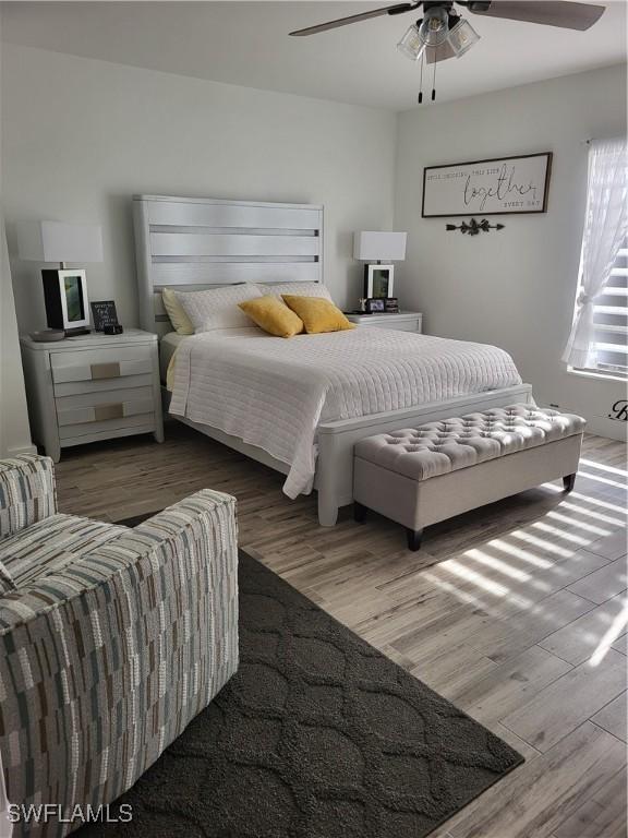 450 S Gulfview Blvd Unit 505, Clearwater, FL 33767 - bedroom with wood finished floors and ceiling fan