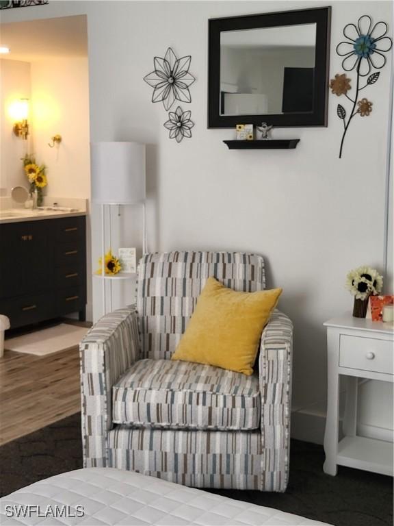 sitting room featuring hardwood / wood-style floors