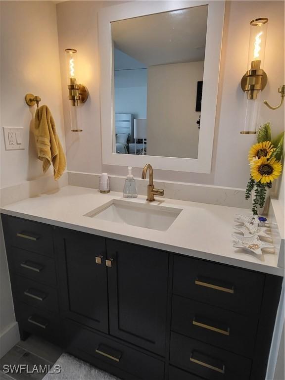 bathroom featuring tile patterned floors and vanity