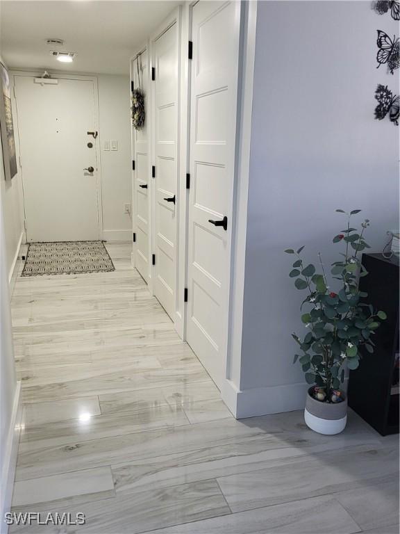 450 S Gulfview Blvd Unit 505, Clearwater, FL 33767 - corridor featuring baseboards