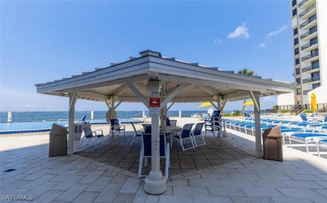 view of home's community featuring a gazebo and a water view