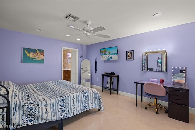 tiled bedroom with ceiling fan and ensuite bath