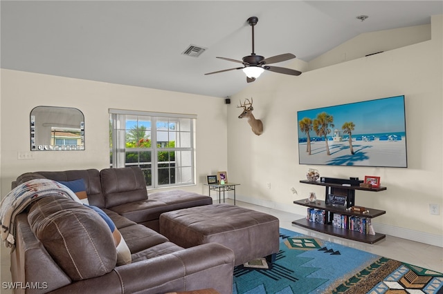 tiled living room featuring ceiling fan and vaulted ceiling