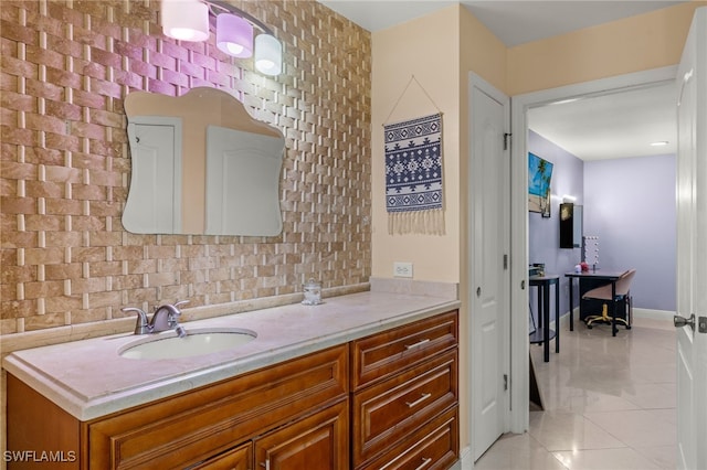 bathroom featuring vanity and backsplash