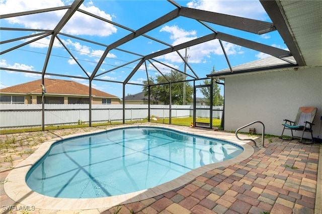 view of pool featuring a patio and a lanai