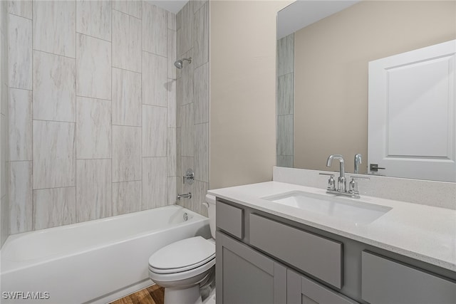 full bathroom with vanity, toilet, and washtub / shower combination