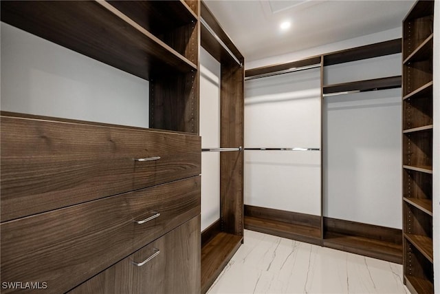 4930 Edith Esplanade, Cape Coral, FL 33904 - walk in closet featuring light marble finish floors
