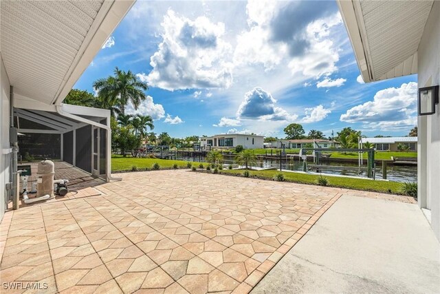 view of patio featuring a dock and a water view