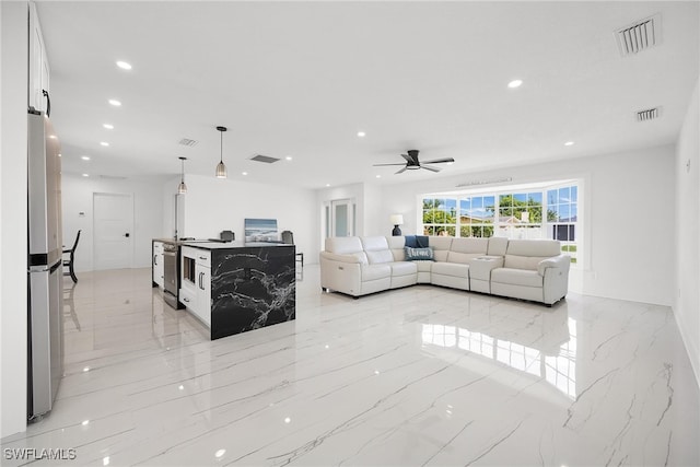 living room featuring ceiling fan