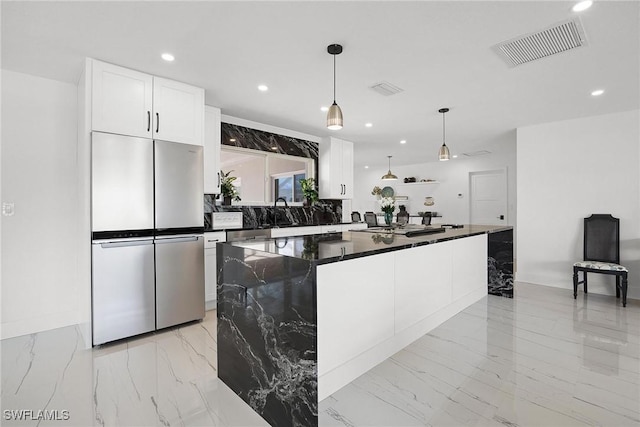 4930 Edith Esplanade, Cape Coral, FL 33904 - kitchen featuring freestanding refrigerator, light marble finish floors, recessed lighting, white cabinets, and decorative light fixtures