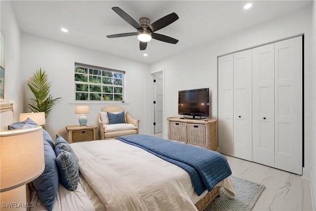 bedroom featuring ceiling fan and a closet