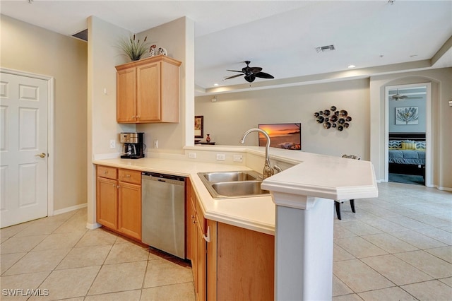 kitchen with dishwasher, sink, kitchen peninsula, light tile patterned floors, and ceiling fan