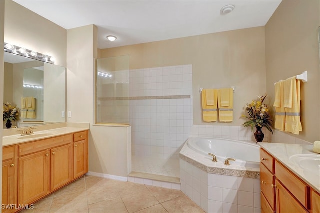 bathroom featuring vanity, plus walk in shower, and tile patterned flooring